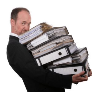 lawyer with binders of paper